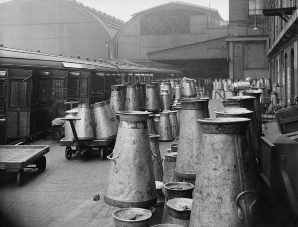 milk churns at Paddington, 1923