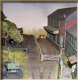 The yard, including a working gate